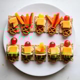 Delicious Choo Choo Train Snack Track loaded with cheese, veggies, and fruits, perfect for a kids' party.