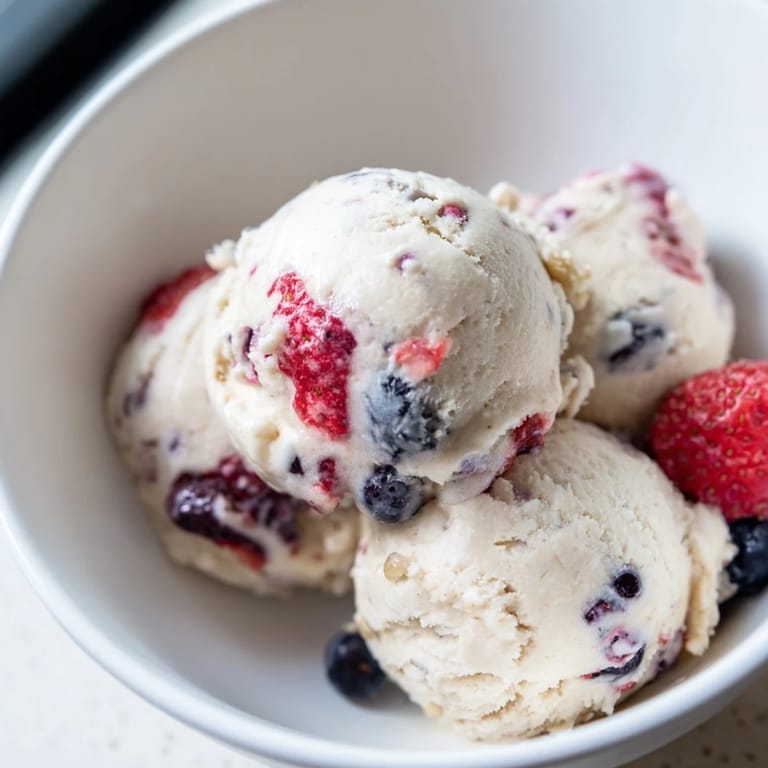 A bowl overflowing with smooth cottage cheese ice cream, ready to be enjoyed on a hot day.